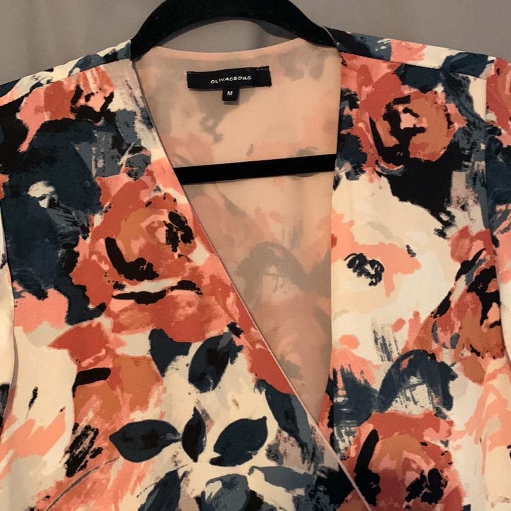 Floral romper with loose sleeves. Size medium
